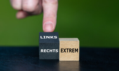 Wooden cubes form the German expression 'linksextrem' (extreme left) and 'rechtsextrem' (extreme right).
