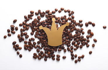 Paper cut crown with coffee beans on white background