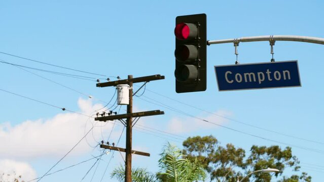 Panning To A Red Light And A Blue Compton Street Sign  - Los Angeles, California