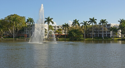 Fountain at center of Lake Osceola to improve aeration and increase species diversification. University of Miami campus in Coral Gables, Florida