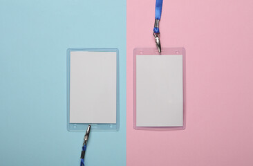 Empty white ID card badges mockup with blue belts on pink blue background. Staff identity name...