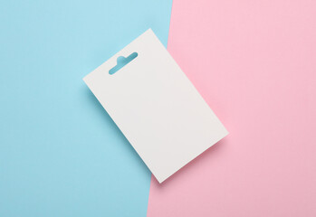 White ID card badge on pink blue background. Mockup for design template