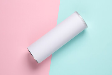 Tin empty tube of chips with a white blank label for your design on a blue-pink background. Top view