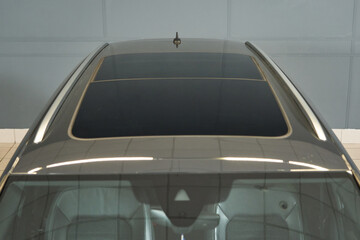 Fototapeta na wymiar Panoramic car roof with sunroof and roof rails for mounting
