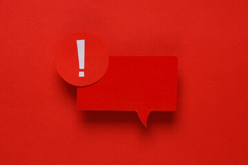 Red important Notification speech bubble on red background. Social media chat, message, sms, subscribe notice alert and reminder. Top view. Creative layout - obrazy, fototapety, plakaty