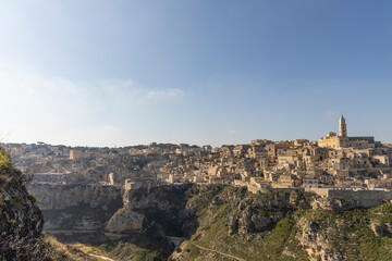 Fototapeta na wymiar Panorama of Matera, a UNESCO World Heritage Site. European Capital of Culture. View from the Murgia Park. Timeless walk on Paleolithic caves and paths. City similar to Jerusalem. Unforgettable journey