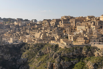 Fototapeta na wymiar Panorama of Matera, a UNESCO World Heritage Site. European Capital of Culture. View from the Murgia Park. Timeless walk on Paleolithic caves and paths. City similar to Jerusalem. Unforgettable journey