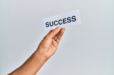 Hand of caucasian man holding paper with success word over isolated white background