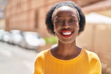 African american woman smiling confident standing at street