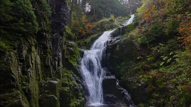 big waterfall in the forest in szklarska poręba poland