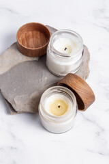 Handmade candles on the stone. Vertical