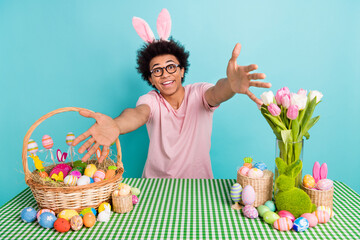 Photo of young guy spring feast easter holiday embrace you bunny headband fresh tulips colored eggs...