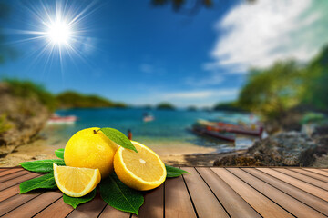 grapefruits fruits on a table in front of a tropical sea