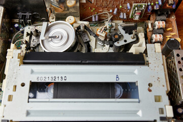Loading a VHS tape and the operation of the tape extension mechanism of the video player. Video...