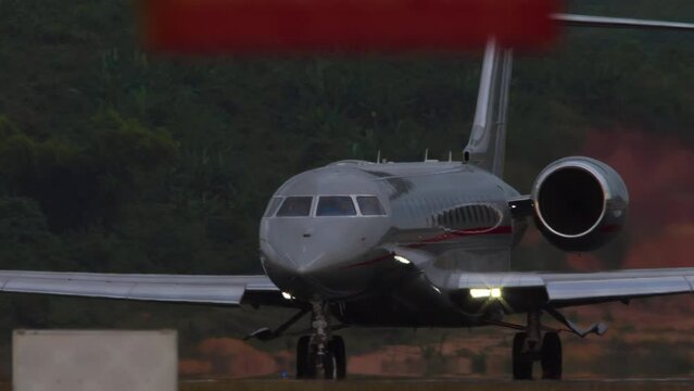 Footage of private business jet taxiing. Airfield. Airplane silhouette on the taxiway