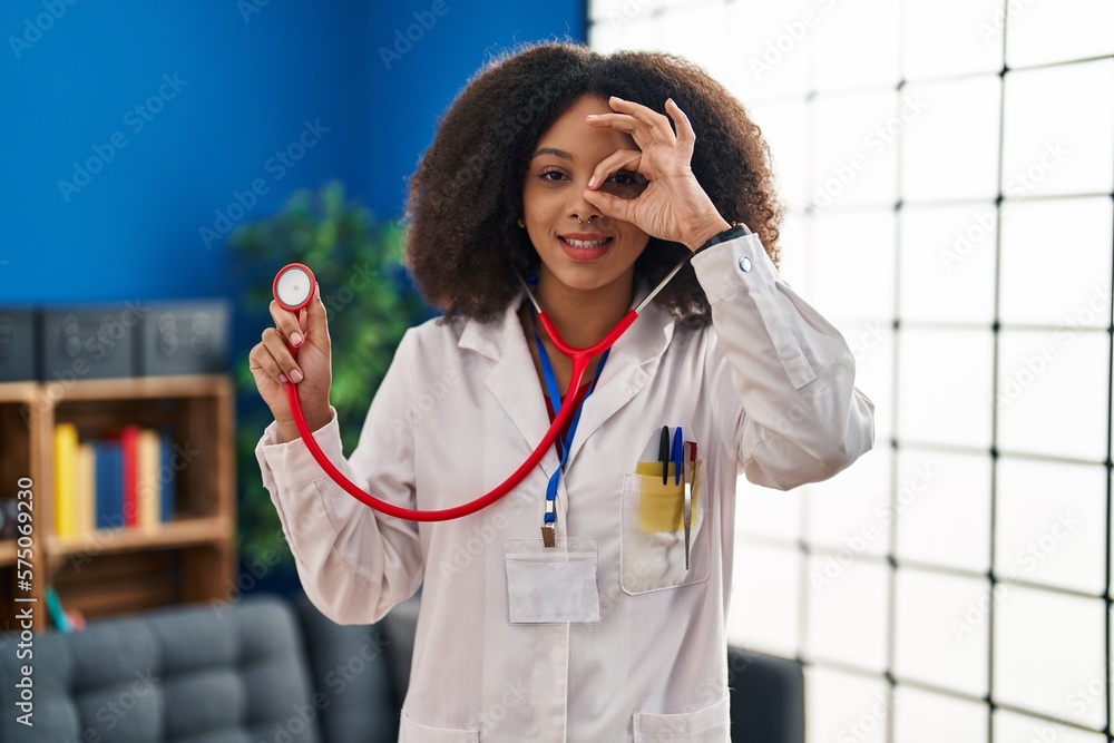 Sticker young african american doctor woman wearing doctor uniform and stethoscope smiling happy doing ok si