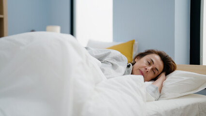 Middle age hispanic woman sleeping on bed at bedroom
