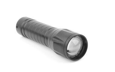 Black metallic flashlight close-up isolated on a white background.