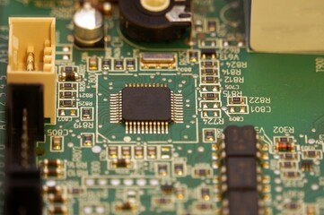 close up of a board. close up of electronic circuit board. Closeup on motherboard. Closeup on circuit board. Closeup on processors, chips, electronic hardware.