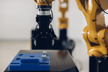 New Generation Robotic Arm Ready for Work on a Production Line. New robot arm  for the production line of industrial factory. Robot arm manipulator at the factory. Industrial automation technology.