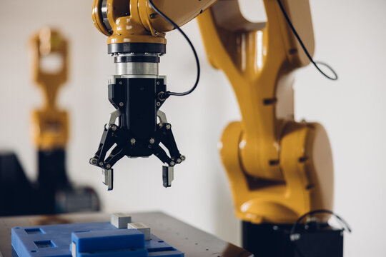 New Generation Robotic Arm Ready for Work on a Production Line. New robot arm  for the production line of industrial factory. Robot arm manipulator at the factory. Industrial automation technology.
