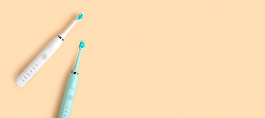 Electric Toothbrush. Top View, Flat Lay, Copy Space. Dental Care Supplies on Beige Pastel Studio...