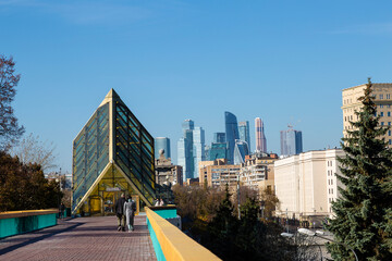 View of the Andreevsky Pedestrian Bridge or Pushkinsky bridge over the Moskva River and the towers of the Moscow City business center. Moscow, Russia