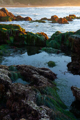 Sunsetting on the rocky coastline of Palos Verdes, neighborhood of Los Angeles county, California. Pictures taken while hiking from the bluffs down to the beach during golden hour and sunset.