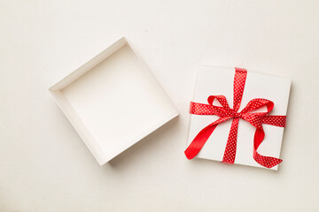 Open gift box on wooden background, top view