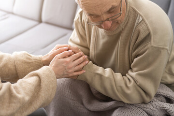 Two people holding hand together. elderly man and support woman