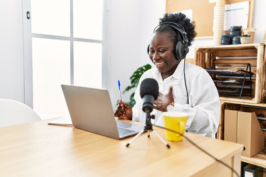 Young african american woman broadcaster smiling confident working at radio studio