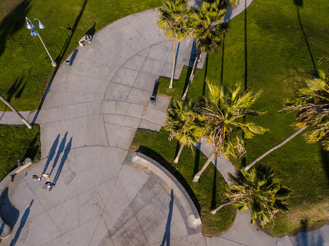 Aerial photography of the venice beach boardwalk, shops, vendors, venice skate park, roller skating area, graffiti walls, beach, and other public areas. Photos taken with a drone in December.