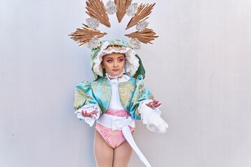 Adorable child wearing virgion custom over isolated white background