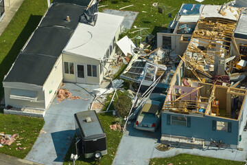 Destroyed by hurricane Ian suburban houses in Florida mobile home residential area. Consequences of...