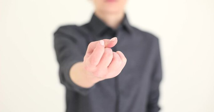 Hand of beautiful woman shows alluring gesture
