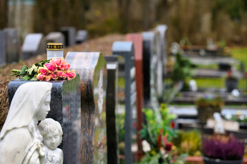 flowers in a cemetery lantern lush mourn colourful sunshine silence faith freedom god halloween...