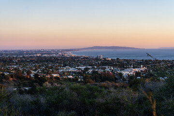 Sunset views from the Santa Monica Mountains while hiking, looking down on the city of Los Angeles and the Santa Monica Bay.