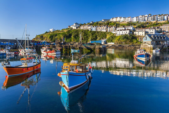Mevagissey inner harbour in Cornwall on a beautiful summer morning.