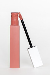 Liquid lipstick open on a white background.