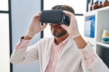 Middle age man scientist using virtual reality glasses at laboratory