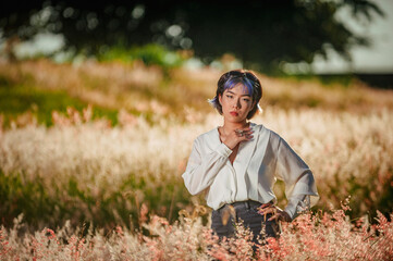 Beautiful asian young colorful hair lady  at the outdoors field.