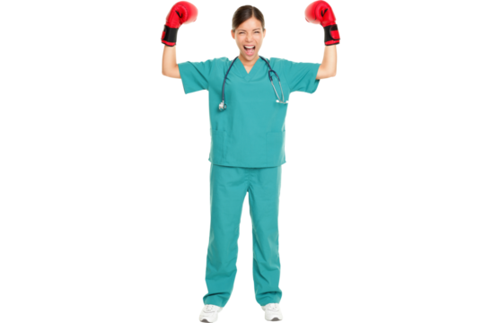 Medical nurse / doctor boxing challenge concept image. Young nurse in scrubs and boxing gloves showing strength and muscles standing in full length isolated in transparent PNG.