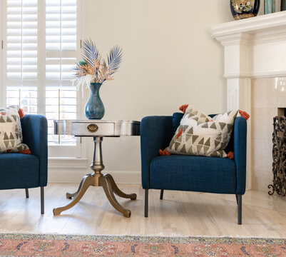 Elegant Living Room with Blue Armchairs and Accent Table in Bright Interior