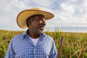 Black male farmer smiling. Brazilian farmer. Family farming. Sugar cane. Closed Plan.