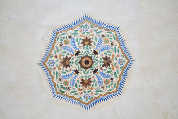 symetrical floral ornament on a ceiling in Amber Palace in Jaipur, Rajasthan, India