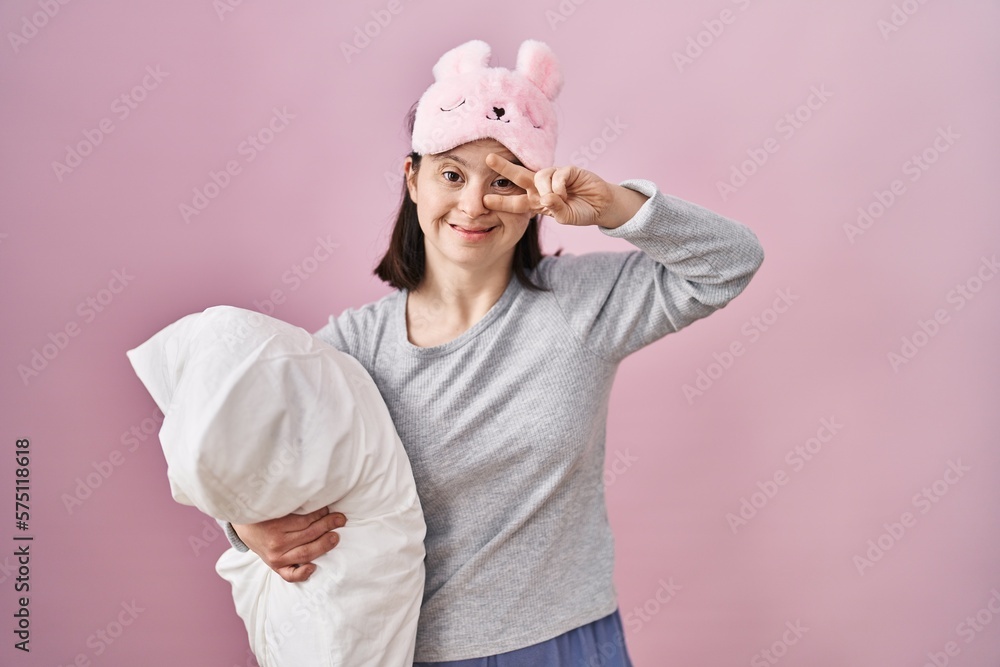 Canvas Prints woman with down syndrome wearing sleeping mask hugging pillow doing peace symbol with fingers over f