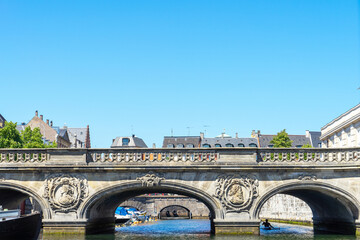 Bas-relief in form of profile of man and woman in oval on bridge in Copenhagen, Denmark. Decor elements of the bridge in Copenhagen. City decorations