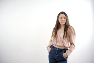 fashion. young woman in trendy sweater and jeans on white background. High quality photo