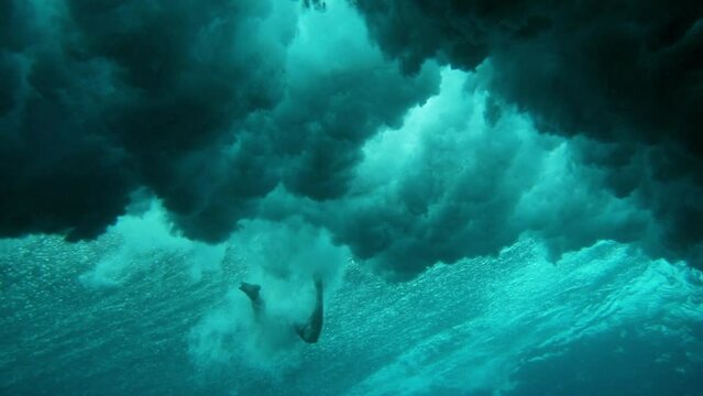 Male Surfer Falling While Surfing In Cloudy Undersea During Adventurous Vacation - Thulusdhoo, Maldives