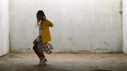 Hip hop woman dancer with talent, creativity and energy in grunge aesthetic warehouse for youth, fitness and wellness lifestyle. Gen z teenager girl dancing with body moves and creative choreography
